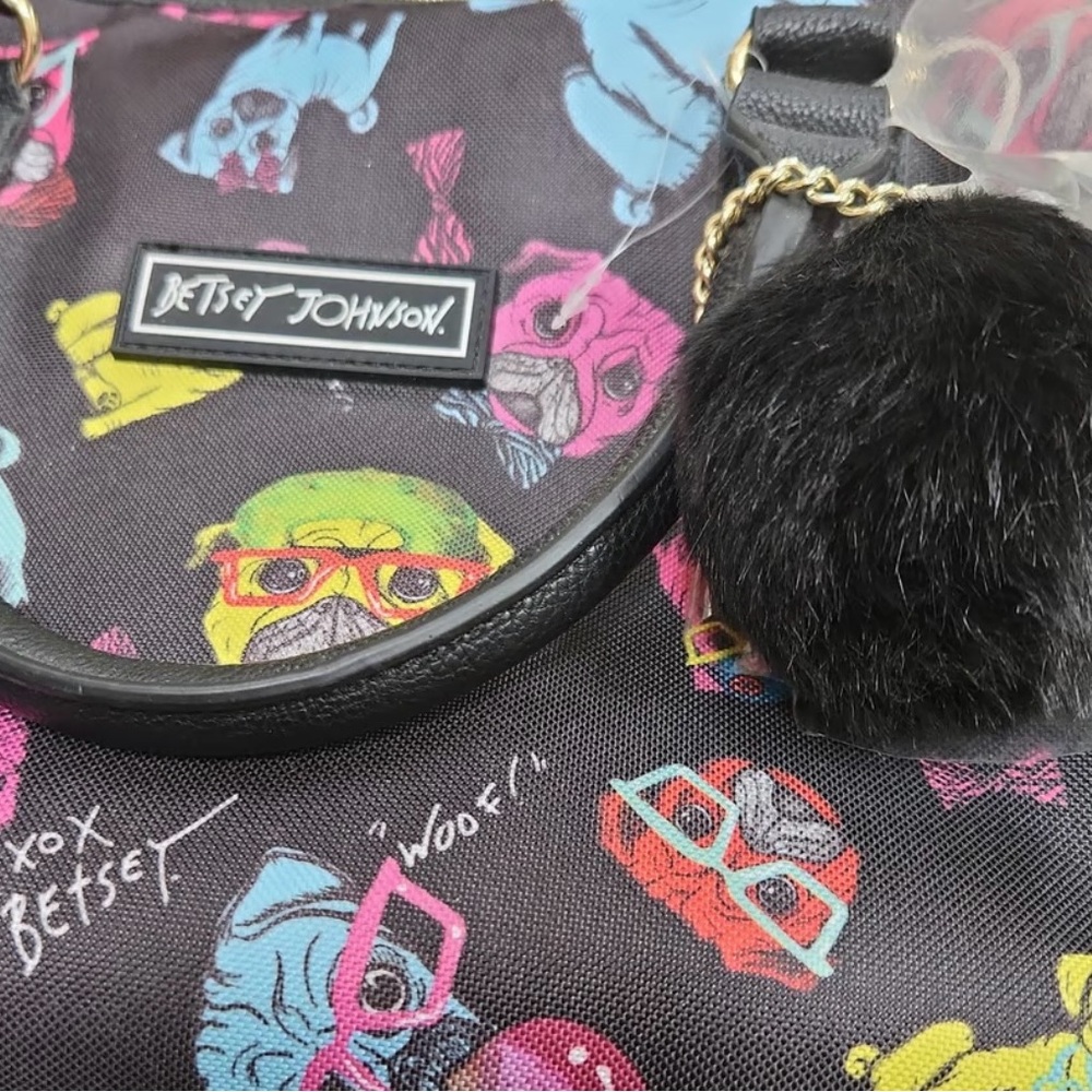 Betsy Johnson duffle bag. Black w/neon pugs and silky flower  interior.